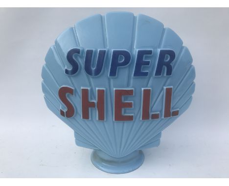A blue Super Shell glass petrol pump globe by Hailware.