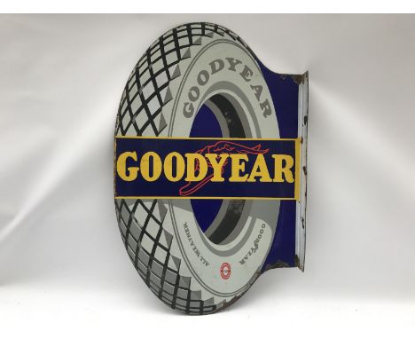 A Goodyear tyre-shaped double sided enamel sign with hanging flange, 22 x 34". 
