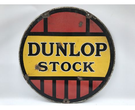 A Dunlop Stock circular double sided enamel sign, 24" diameter.