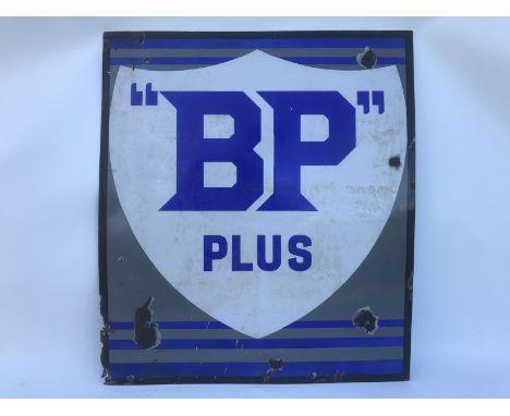 An early BP Plus enamel sign showing a white shield with blue lettering on a grey background, 21 x 24".