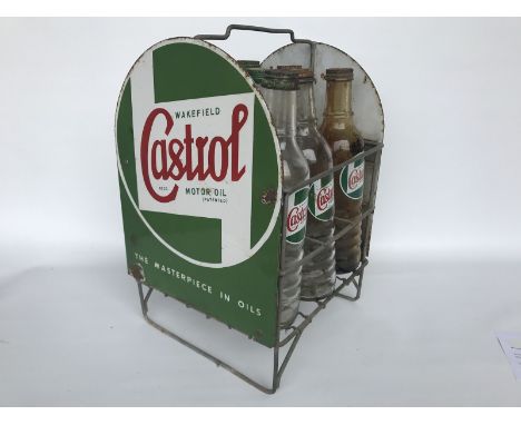 A Wakefield Castrol Motor Oil nine bottle crate, with a dome topped enamel sign to each end and nine correct Castrol bottles 