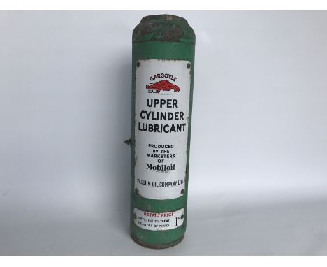 A Mobiloil Upper Cylinder Lubricant cylindrical dispensing cabinet with good enamel signs to the front and dispensing gun ins