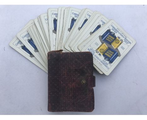 A group of Carburine & Glico-Newton Motor Oils pictorial playing cards in a leather pouch.