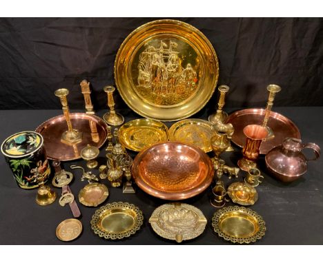 A pair of brass candlesticks; others; copper circular trays; a Jersey copper jug and cover; brass bell; miniature longcase cl