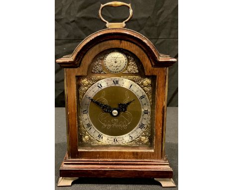 An Elliot mantel clock, of George III miniature bracket timepiece design, brass carrying handle and bracket feet, 22cm high 