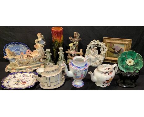 Ceramics - an early 19th century Castleford teapot; a Jackfield type cow creamer; a 19th century majolica table centre piece;