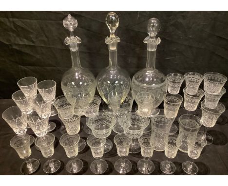 An early 20th century "Pall Mall" acid etched decanter and stopper; two others similar; a part suite of accompanying drinking