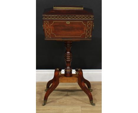 A 'Regency' brass strung rosewood teapoy, sarcophagus tea caddy top with lion mask ring handles to sides, turned column, quad