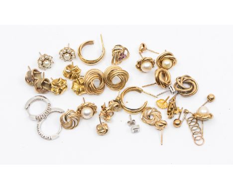 A collection of twelve pairs of 9ct gold earrings, comprising various shapes and styles, including a pair of diamond set whit