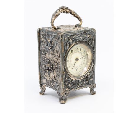 An Edwardian silver carriage clock, having elaborate chased and embossed Art Nouveau floral decoration to case, four cabriole
