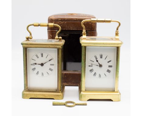A late 19th Century French brass carriage clock in travel case along with a later brass carriage clock.