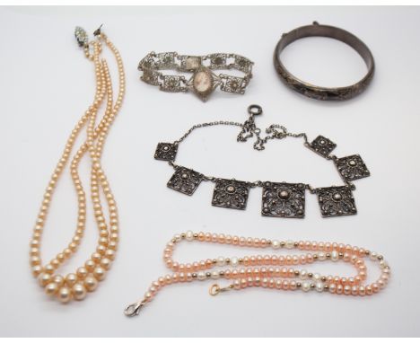 A niello silver bangle, along with an Ethnic white metal filigree necklace, together with a similar white metal bracelet, a c