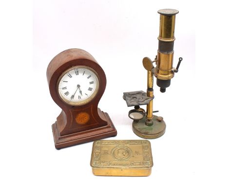 An Edwardian mahogany balloon mantle clock with flower inlay and Roman numerals along with a WWI 1914 Christmas tin and an ea