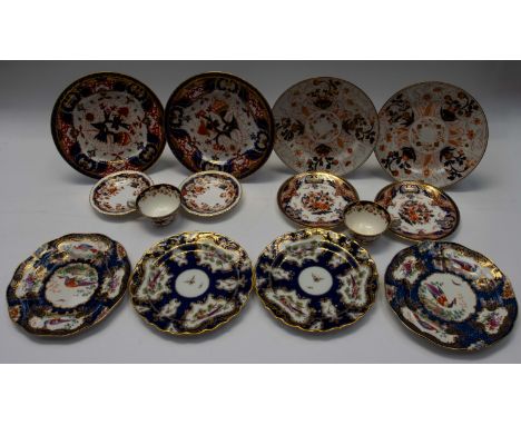 A collection of Worcester decorative plates along with Spode cups and saucers.