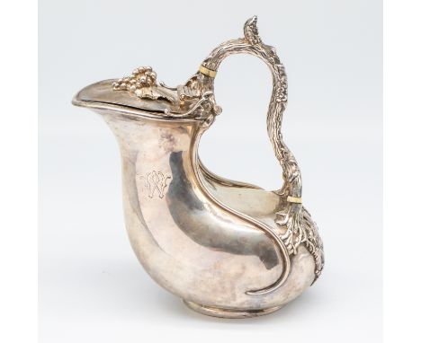 A Victorian silver Askos jug, of classical Greek askos form, plain body engraved with crest above banner motto and initial W.