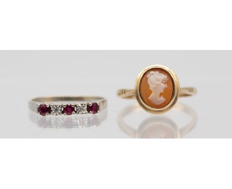 A ruby and diamond 14ct white gold half eternity ring, comprising three round mixed cut rubies with small illusion set diamon