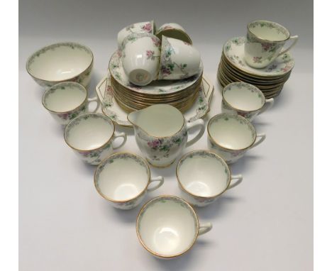 A Shelley 'Bramble Rose' pattern tea service consisting of twelve cups and saucers, twelve side plates, two cake/sandwich pla