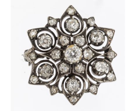 A diamond and white metal pendant brooch, the principal old cut diamond claw set to the centre weighing approx 0.40ct, overla