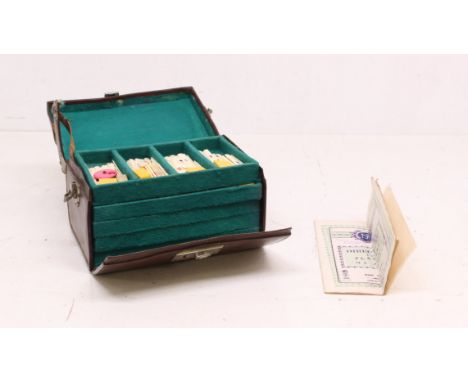 Mahjong: A cased mid-20th century bone mahjong set. Contents appear complete and in very good condition. Case has some damage