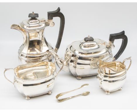 A matched George V silver four piece tea and coffee service comprising: tea pot, coffee pot, sugar bowl and milk jug, all wit