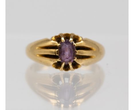 An amethyst and 18ct gold set ring, comprising a oval claw set amethyst, size O, total gross weight approx 5.6gms   Further d