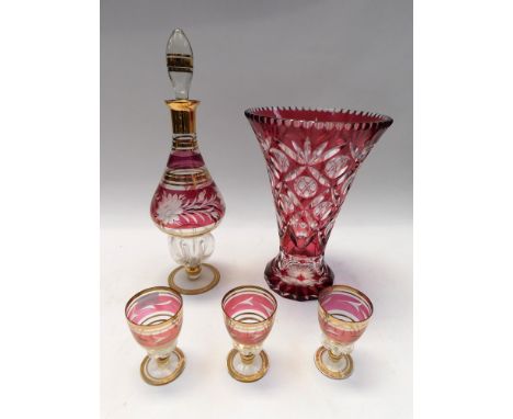 Mid 20th Century red glass continental decanter and three glasses along with a large continental ruby cut glass vase, chips t