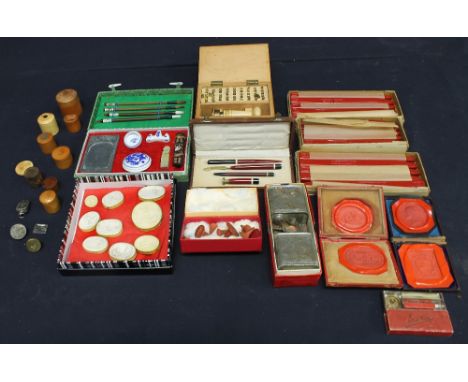 A collection of 19th Century red wax seals, fruitwood cased steel seals, this lot also includes boxes of seal wax (Rekcana si