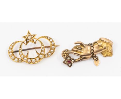 Two early 20th century brooches to include a 9ct gold ruby, diamond and pearl set brooch in the form of a gloved hand claspin
