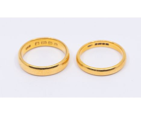 Two 22ct gold bands, width approx 5mm and 3mm, sizes P1/2, and O, weight approx 12.1gms   Further details: wear and tera comm