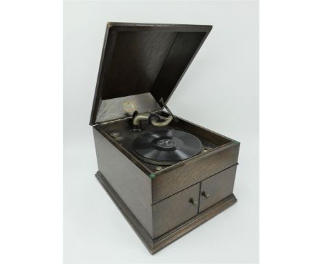 1930s/40s HMV wind up gramophone in oak case with front opening speaker doors. 41cm x 49cm x 35cm. Currently fully working.