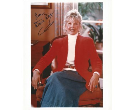 Doris Day signed 10 x 8 inch colour portrait photo. Good Condition.  All autographs come with a Certificate of Authenticity. 