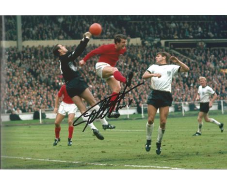 Geoff Hurst signed 12 x 8 inch colour 1966 World Cup final football photo. Good Condition.  All autographs come with a Certif