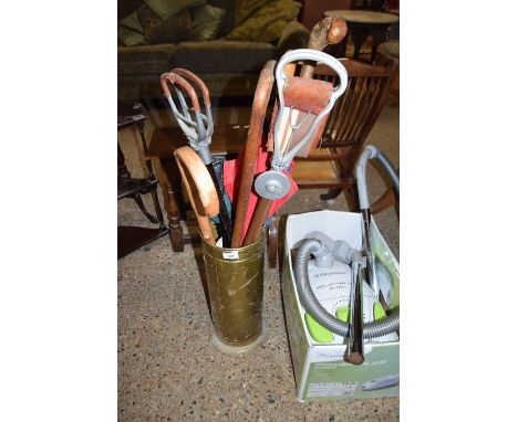 BRASS STICK STAND CONTAINING QUANTITY OF VARIOUS SHOOTING STICKS ETC