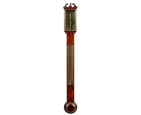 A George III mahogany stick barometer, with a broken swan neck pediment with a hinged door, above a silvered dial inscribed '