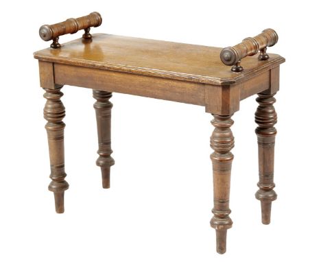 A late Victorian walnut hall bench, with a pair of turned faux bamboo lifts on ring turned tapering legs, 51.5cm high, 61.1cm