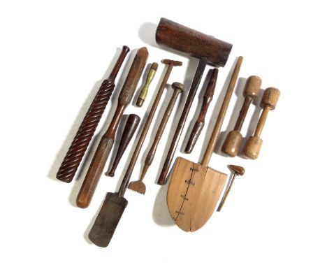 Treen. A collection of carved and turned tools, including: a mallet, dumbbells, a scraper, a spade, a baker's shovel, two clu