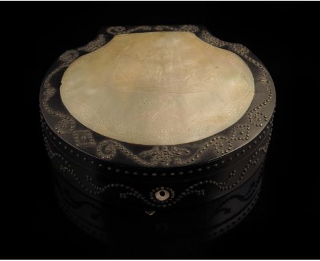 An early 19th century ebonised and cut steel necessaire, the hinged lid inset with a mother of pearl panel carved with a scen