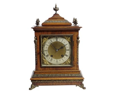 A Victorian oak and gilt brass mantel clock, the eight day German movement striking the quarters and hours on two gongs, the 
