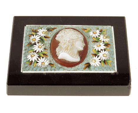 A late 19th century Italian micromosaic paperweight, inlaid with flowers and centred with a probably glass cameo portrait bus