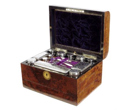 A Victorian burr walnut and ebony dressing case, the hinged lid inset with an engraved brass plaque inscribed 'Ella Waddell J