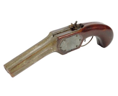 Treen. A mahogany and parcel gilt novelty bootjack in the form of a pistol, hinged to reveal a mechanism stamped 'MAGIC', 25.