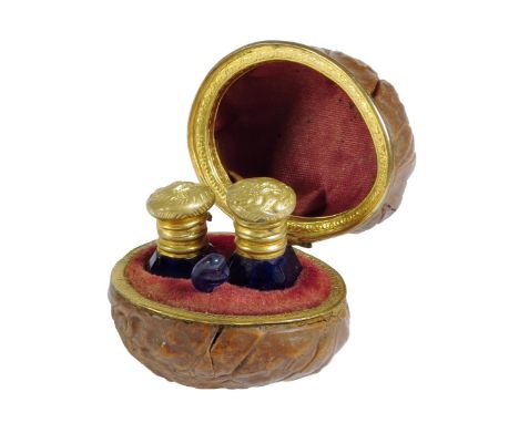 A 19th century French walnut and gilt metal mounted etui, the interior fitted with a pair of glass scent bottles with gilt me