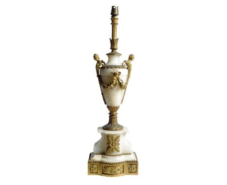 An onyx and ormolu table lamp in Louis XVI style, in the form of an urn decorated with females caryatids with ribbon tied swa