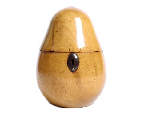 A George II fruitwood tea caddy, in the form of a pear with an iron oval escutcheon, the interior with traces of a foil linin