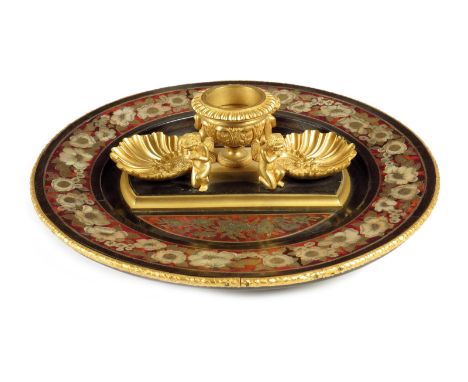 λ A Napoleon III ebony and boulle marquetry deskstand, with an ormolu centrepiece with an urn flanked by shells and four knee