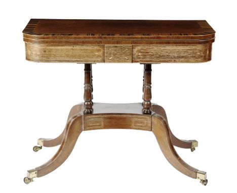 λ A Regency partridgewood card table in the manner of George Oakley, inlaid with boxwood stringing, the 'D' shaped hinged swi