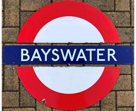 London Underground enamel PLATFORM ROUNDEL from Bayswater station on the District &amp; Circle Lines. A medium-size sign in t
