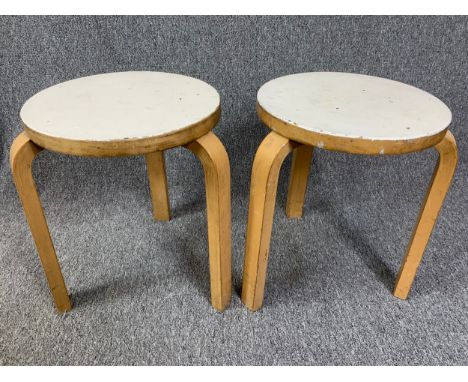 A pair of mid century Alvar Aalto stools, model 60, stamped to base, possibly it reads Finmar Design. H.45 Dia.35cm 