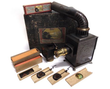 A GEBRUDER BING CHILD'S MAGIC LANTERN  of tin and brass construction, in original box with pictorial paper label; together wi