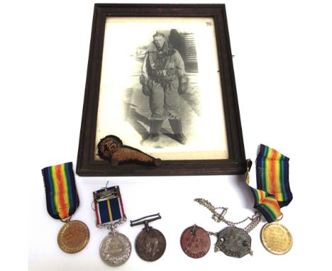 ASSORTED MILITARIA  comprising a Second World War era black and white full-length portrait photograph of an R.A.F. airman, th